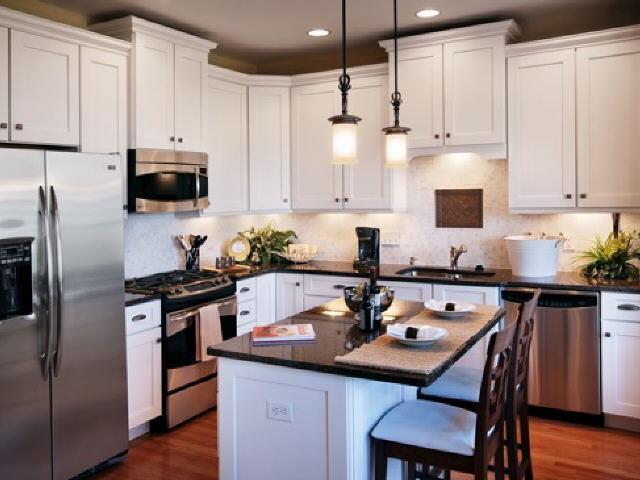 a kitchen with a sink stove and refrigerator