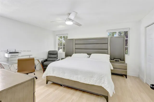 a bedroom with a bed and lamp