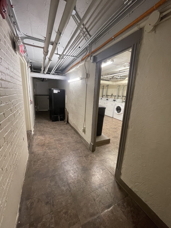 660 Huntington Avenue, Unit 58 Boston, MA 02115 - Photo 11 of 19 a view of a hallway with wooden walls