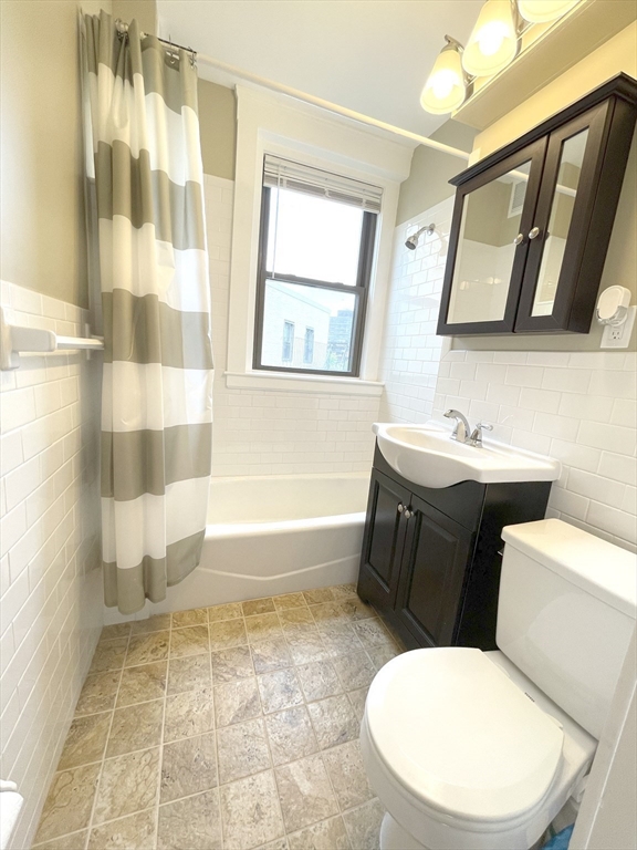 660 Huntington Avenue, Unit 58 Boston, MA 02115 - Photo 8 of 19 a bathroom with a sink toilet and shower