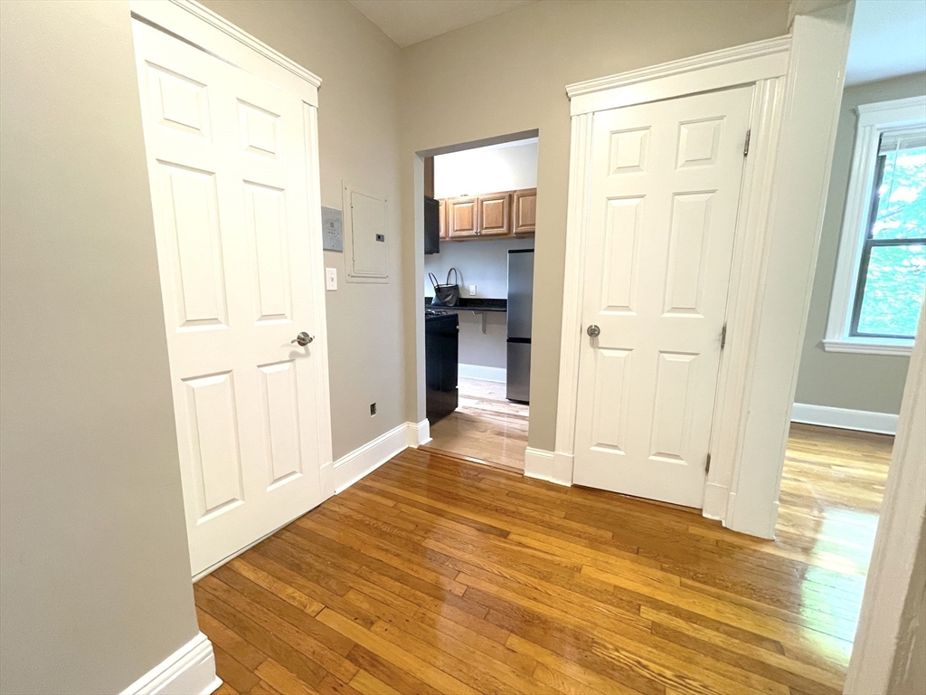 660 Huntington Avenue, Unit 58 Boston, MA 02115 - Photo 9 of 19 a view of a room that has a bed and wooden floor