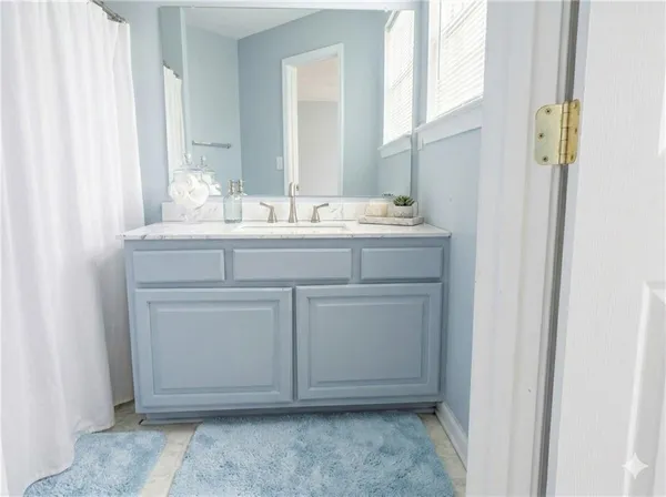 a bathroom with a sink and a mirror