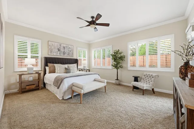 a spacious bedroom with a bed and a couch