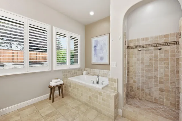 a bathroom with a bathtub and a sink