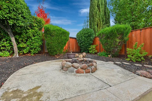 a view of house with swimming pool outdoor seating