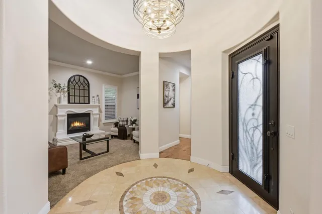 a view of a livingroom with furniture and front door