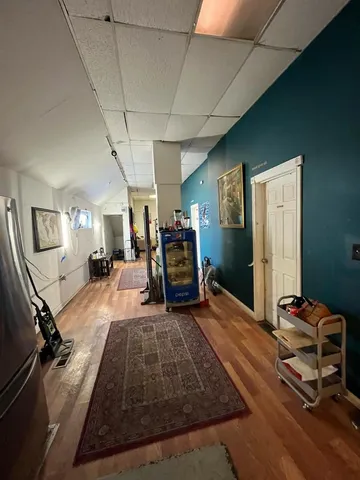 a room with gym equipment and a mirror