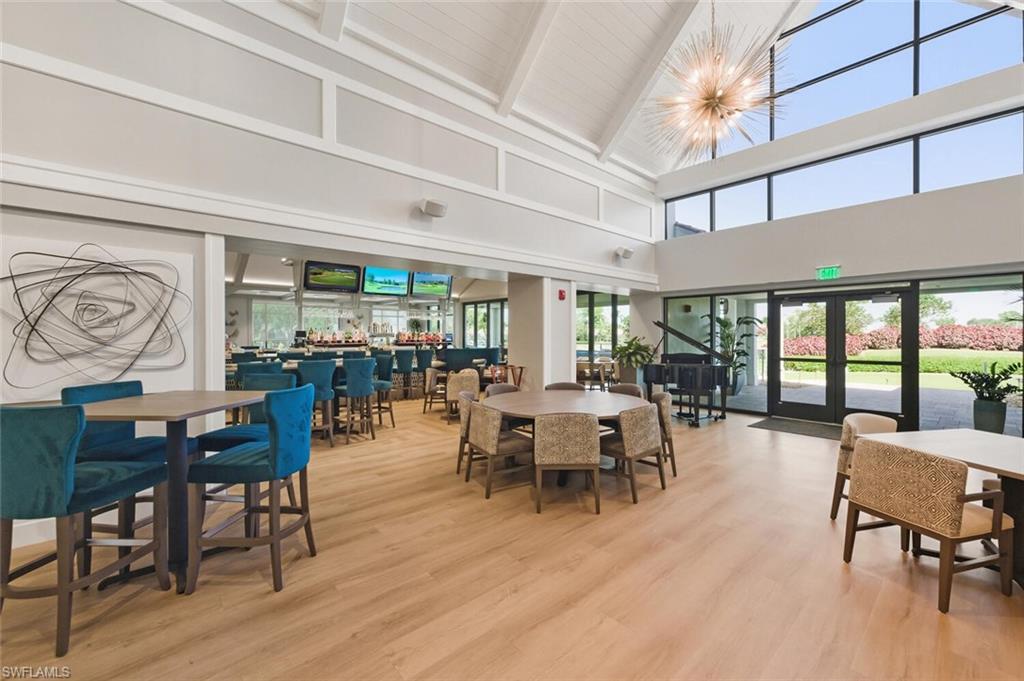 209 Countryside Drive Naples, FL 34104 - Photo 42 of 50 Dining space featuring french doors, light wood-type flooring, lofted ceiling, and suspended lighting