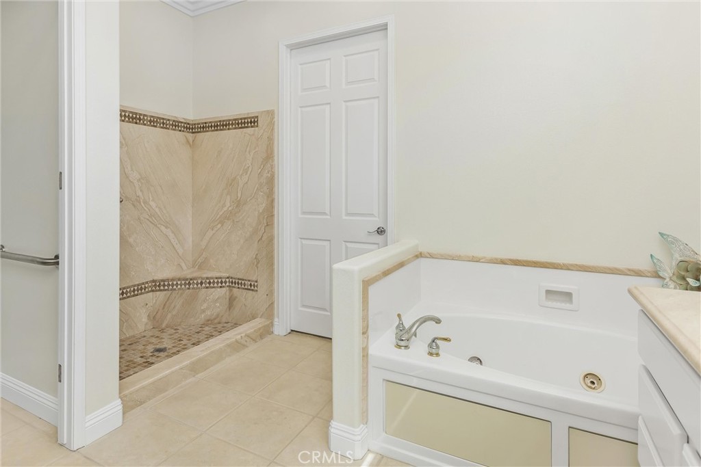 5233 Hampton Road Banning, CA 92220 - Photo 26 of 46 a bathroom with a bathtub and a shower