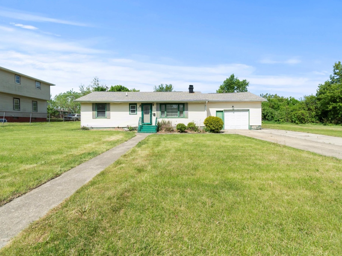 1317 Fairview Avenue Joliet, IL 60432 - Photo 1 of 19 a view of a house with a big yard and palm trees