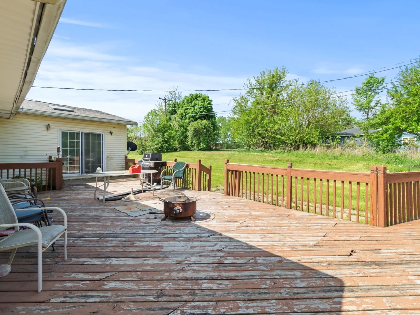 1317 Fairview Avenue Joliet, IL 60432 - Photo 15 of 19 a view of a patio with dining table and chairs with wooden floor and fence