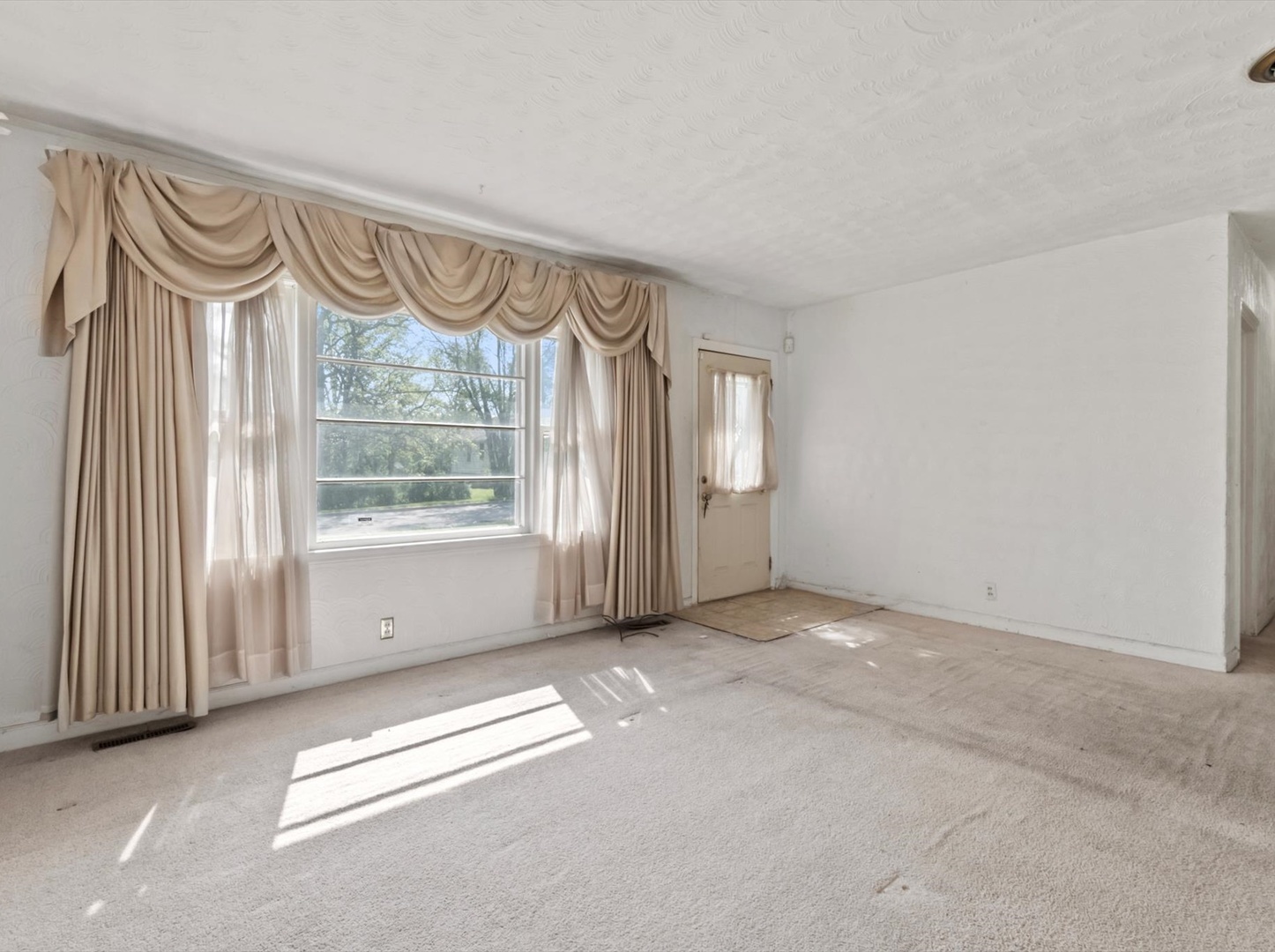 1317 Fairview Avenue Joliet, IL 60432 - Photo 2 of 19 a view of an empty room with a window and a bathroom