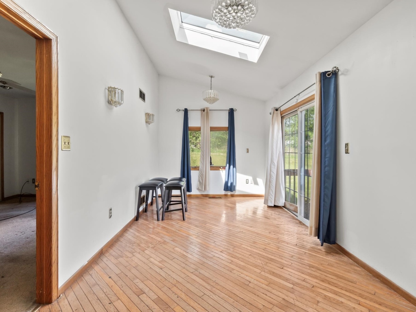 1317 Fairview Avenue Joliet, IL 60432 - Photo 5 of 19 wooden floor in an empty room with a window