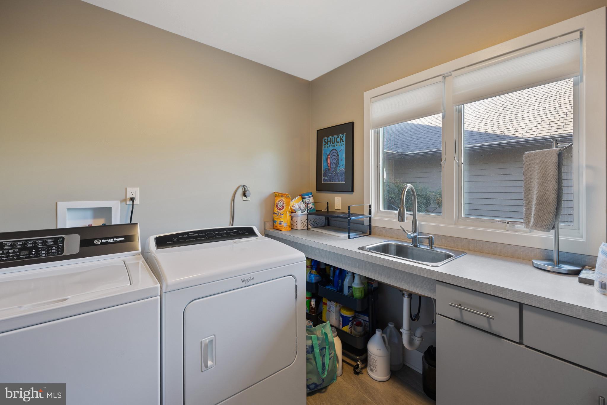 8645 Northbend Circle Easton, MD 21601 - Photo 46 of 70 Dedicated laundry with sink, storage