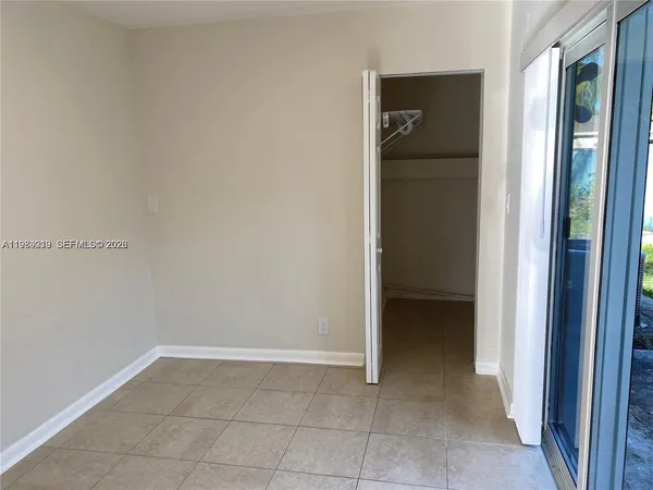 an empty room with white walls