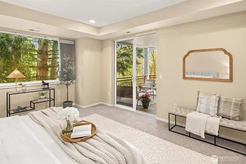 a bedroom with a bed and a lamp