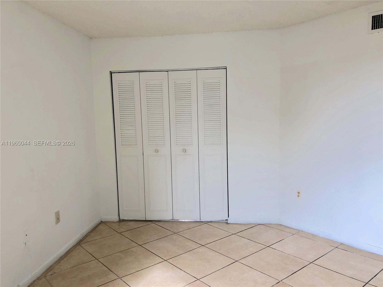 6280 Northwest 186th Street, Unit 311 Hialeah, FL 33015 - Photo 15 of 21 a view of an empty room