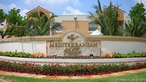 6280 Northwest 186th Street, Unit 311 Hialeah, FL 33015 - Photo 18 of 21 a front view of a house