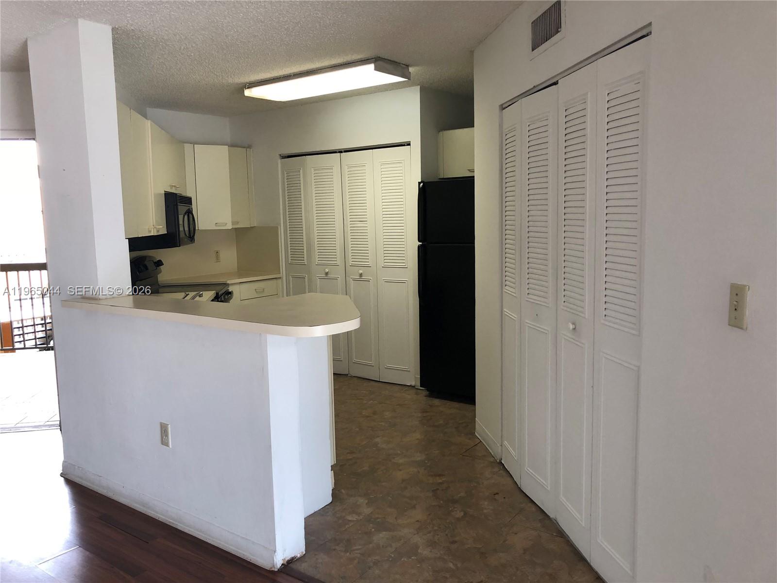 6280 Northwest 186th Street, Unit 311 Hialeah, FL 33015 - Photo 6 of 21 a bathroom with a sink and a mirror