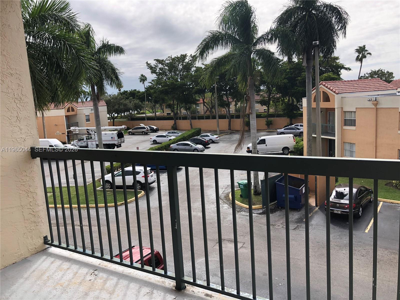 6280 Northwest 186th Street, Unit 311 Hialeah, FL 33015 - Photo 10 of 21 a view of a street from a balcony