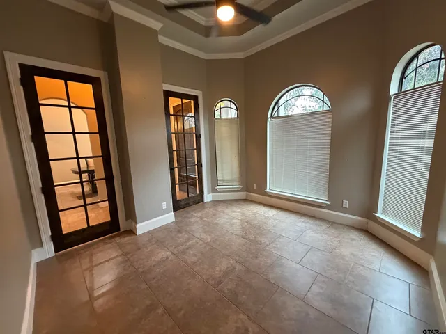 a view of a livingroom with furniture and a flat screen tv