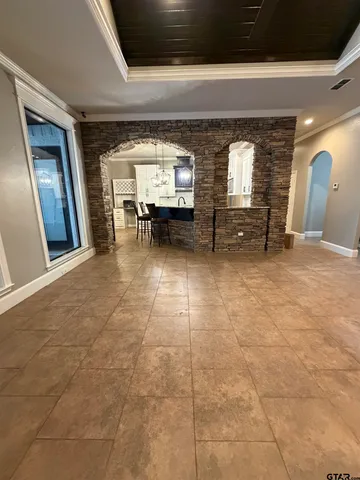 a kitchen with a stove sink and cabinets
