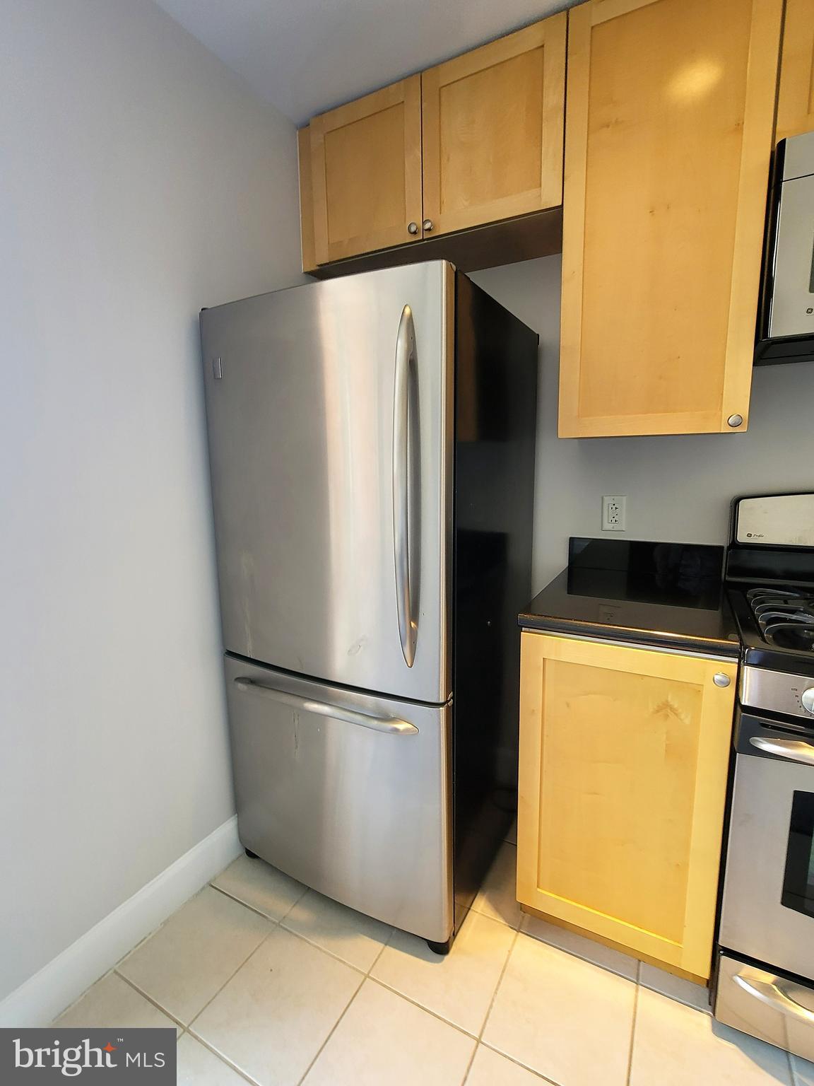 3600 South Glebe Road, Unit 602W Arlington, VA 22202 - Photo 21 of 46 a refrigerator freezer sitting in a kitchen with a refrigerator