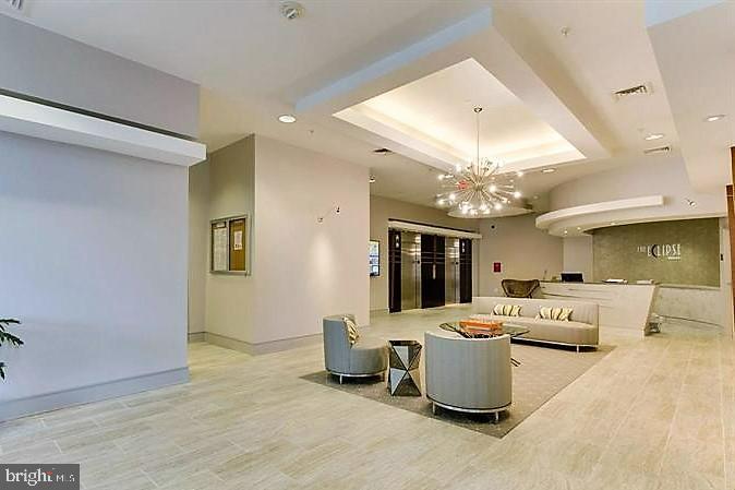 3600 South Glebe Road, Unit 602W Arlington, VA 22202 - Photo 24 of 46 a living room with furniture and a chandelier