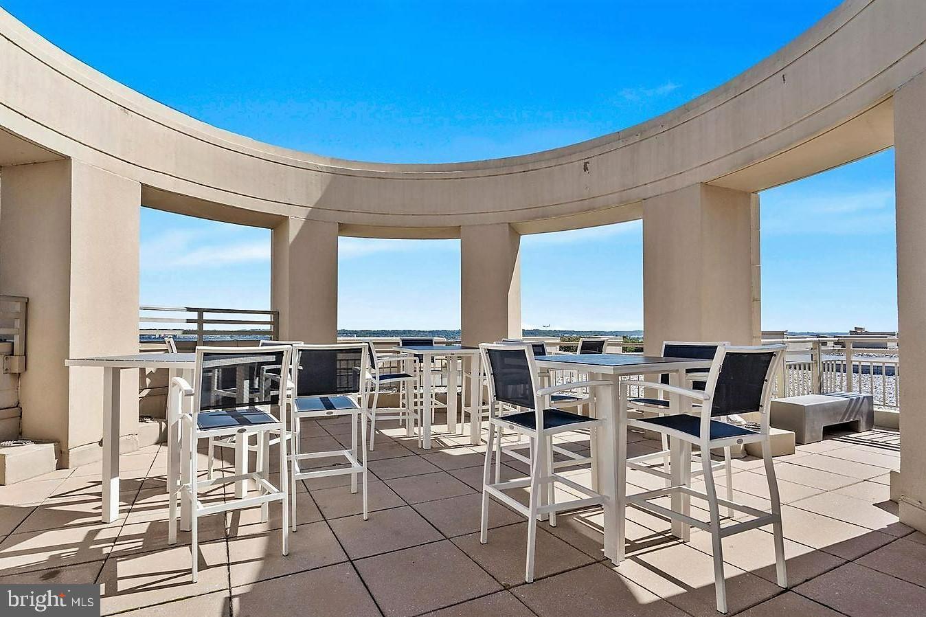 3600 South Glebe Road, Unit 602W Arlington, VA 22202 - Photo 30 of 46 a view of a dinning table and chairs in the patio