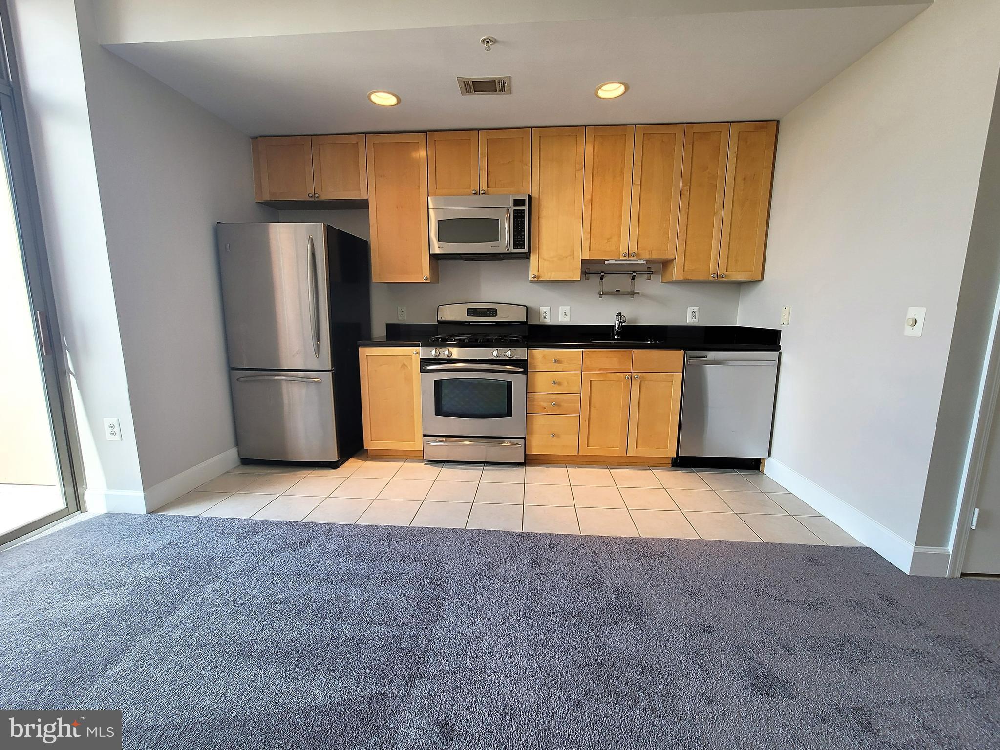 3600 South Glebe Road, Unit 602W Arlington, VA 22202 - Photo 3 of 46 a kitchen with stainless steel appliances granite countertop a refrigerator a stove a sink and a oven