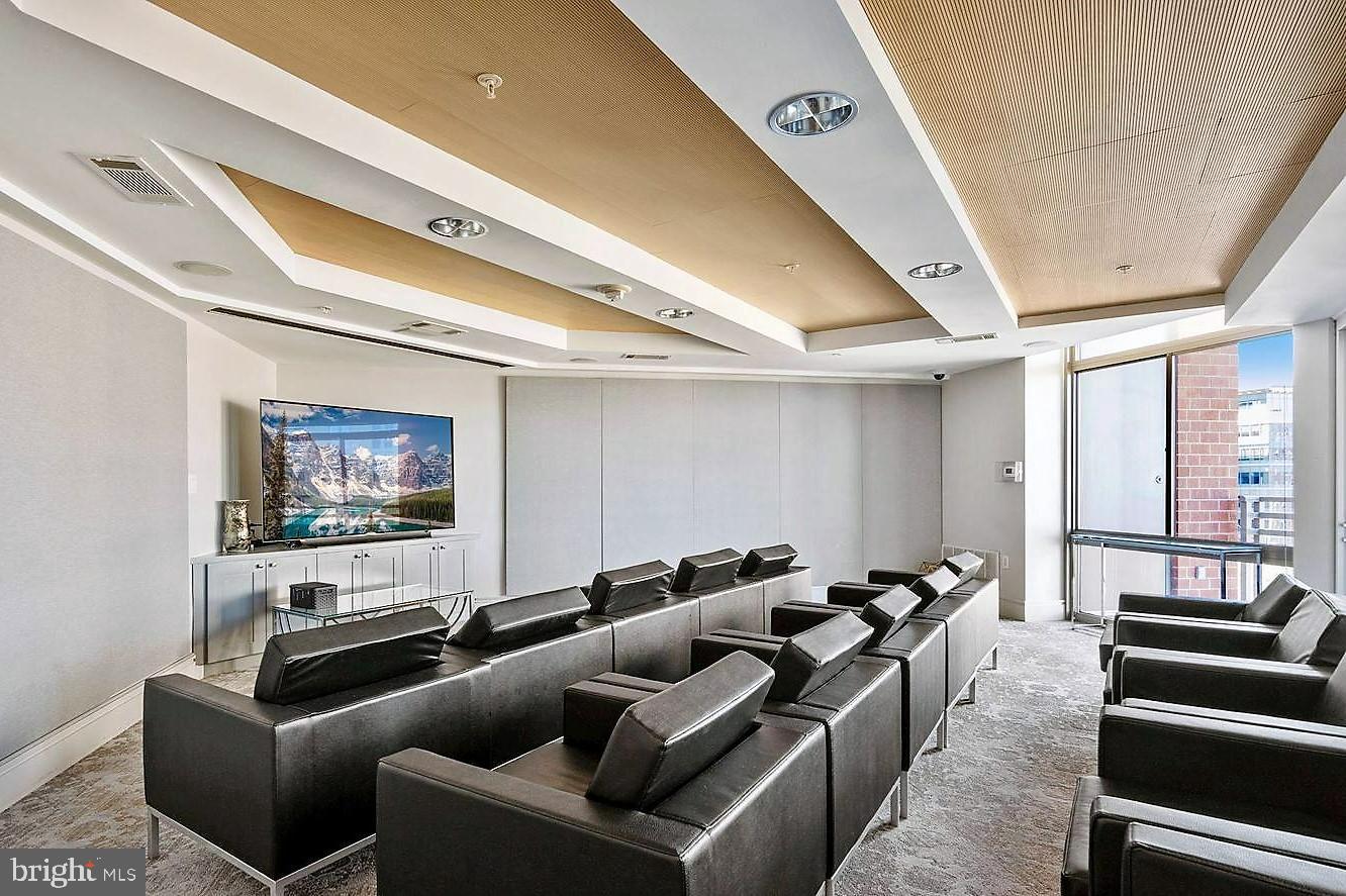 3600 South Glebe Road, Unit 602W Arlington, VA 22202 - Photo 32 of 46 a media room with lots of chairs and a projector