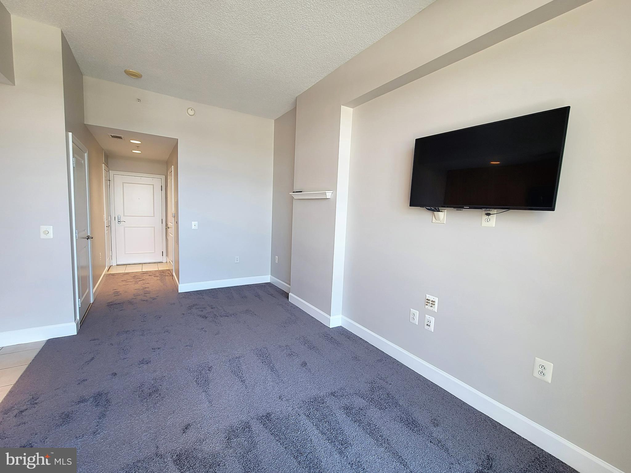 3600 South Glebe Road, Unit 602W Arlington, VA 22202 - Photo 33 of 46 a view of a livingroom with an empty space and a flat screen tv