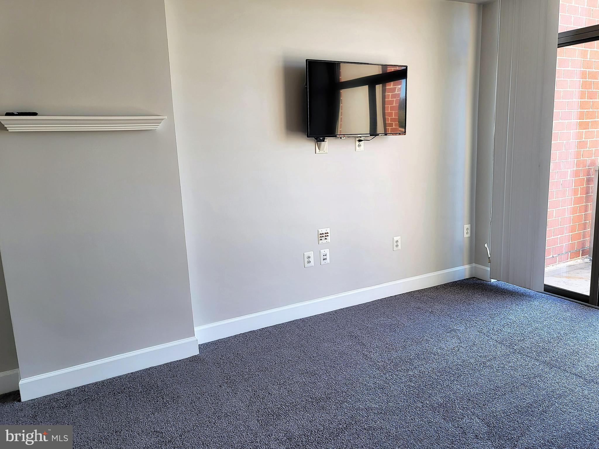 3600 South Glebe Road, Unit 602W Arlington, VA 22202 - Photo 38 of 46 an empty room with wooden floor and windows