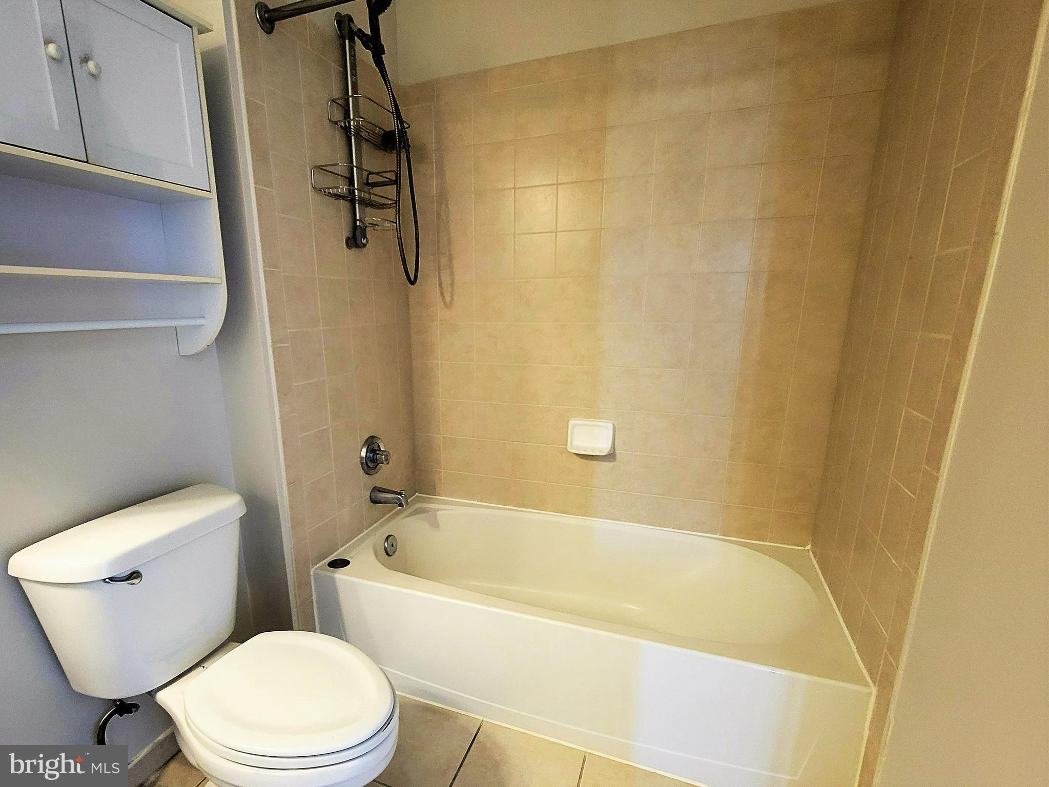 3600 South Glebe Road, Unit 602W Arlington, VA 22202 - Photo 8 of 46 a white bath tub sitting next to a white toilet