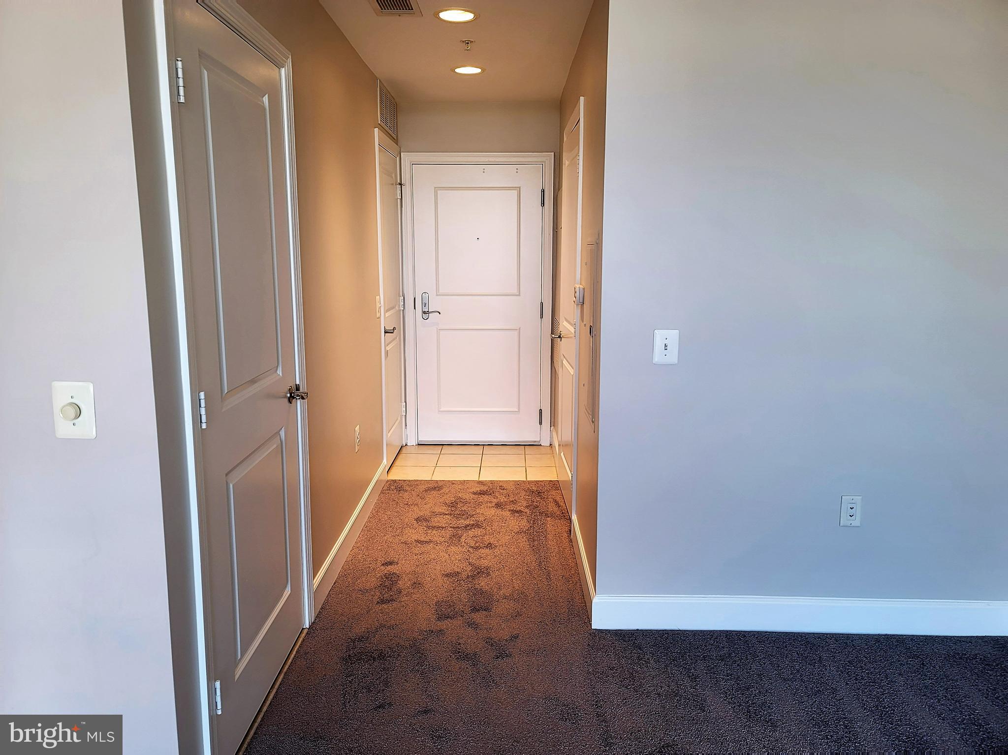 3600 South Glebe Road, Unit 602W Arlington, VA 22202 - Photo 10 of 46 a view of a hallway with wooden floor and a bathroom
