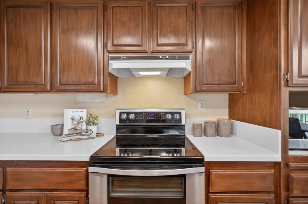 7649 El Modena Avenue Elverta, CA 95626 - Photo 19 of 75 a stove top oven sitting inside of a kitchen