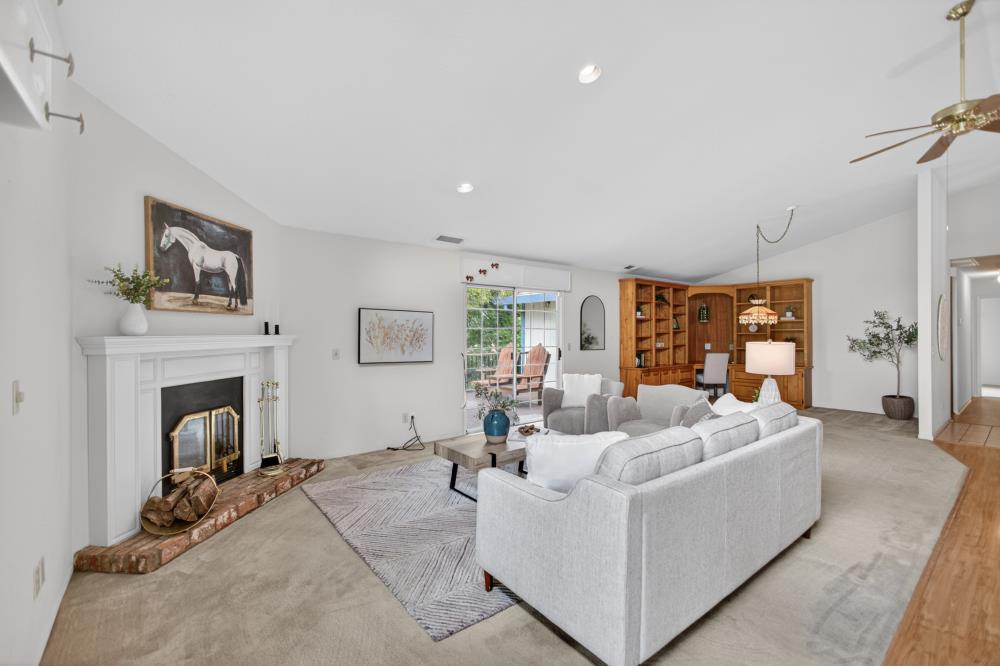 7649 El Modena Avenue Elverta, CA 95626 - Photo 23 of 75 a living room with furniture and a fireplace