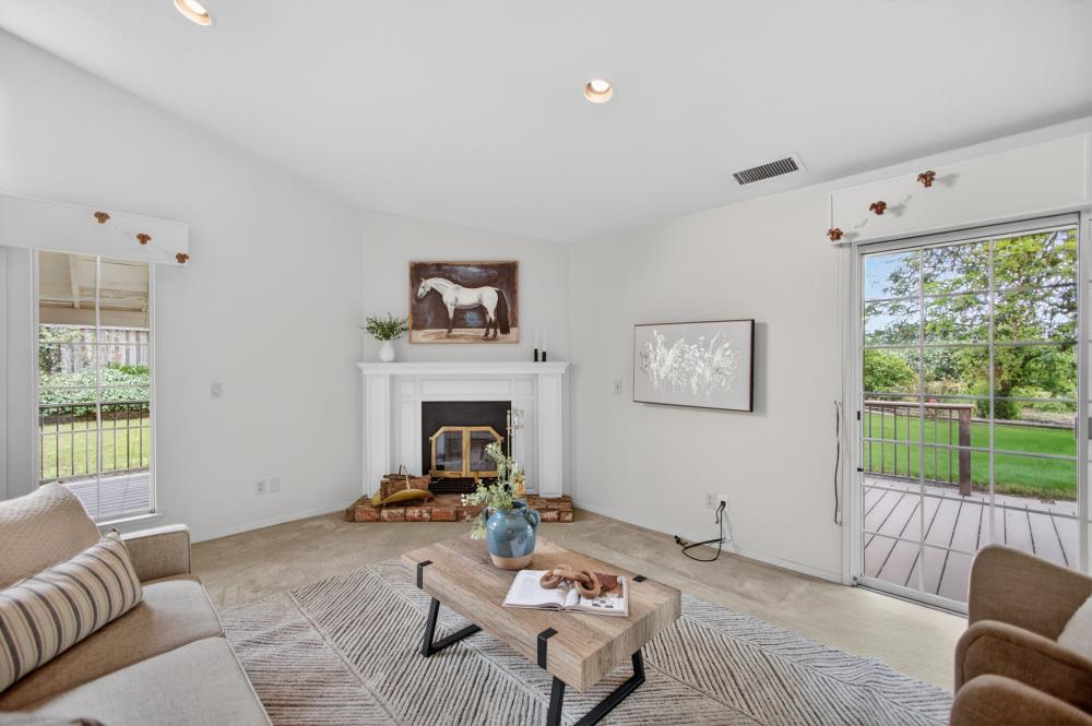7649 El Modena Avenue Elverta, CA 95626 - Photo 28 of 75 a living room with furniture and a fireplace