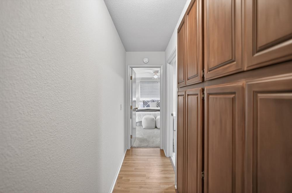 7649 El Modena Avenue Elverta, CA 95626 - Photo 30 of 75 a view of a hallway with wooden floor and staircase