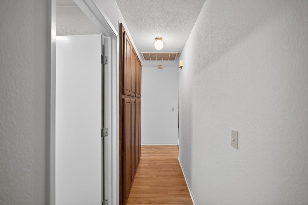 7649 El Modena Avenue Elverta, CA 95626 - Photo 34 of 75 a view of a hallway with wooden floor
