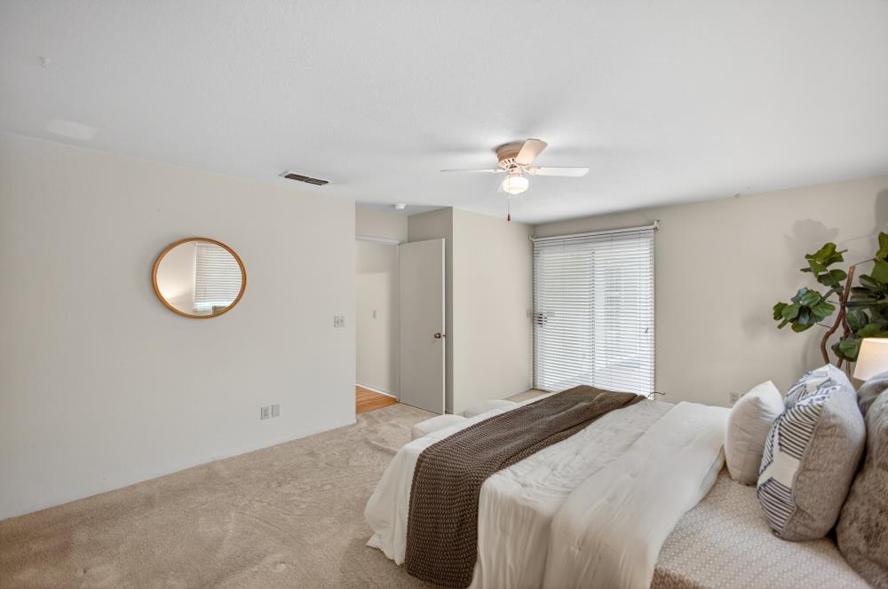 7649 El Modena Avenue Elverta, CA 95626 - Photo 36 of 75 a bedroom with a bed and a chandelier