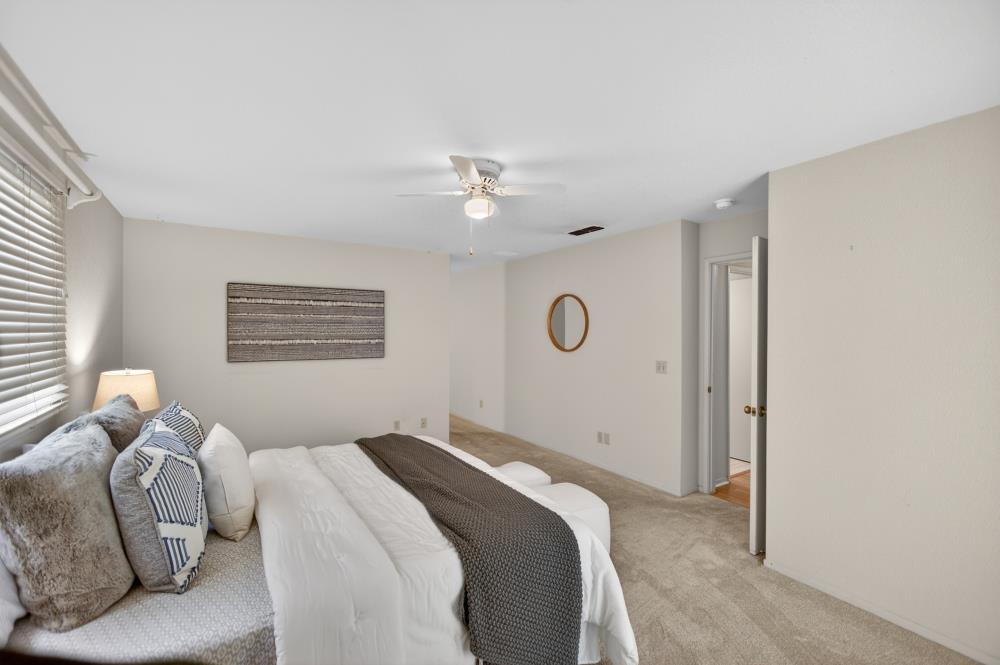 7649 El Modena Avenue Elverta, CA 95626 - Photo 37 of 75 a bedroom with a bed and a chandelier