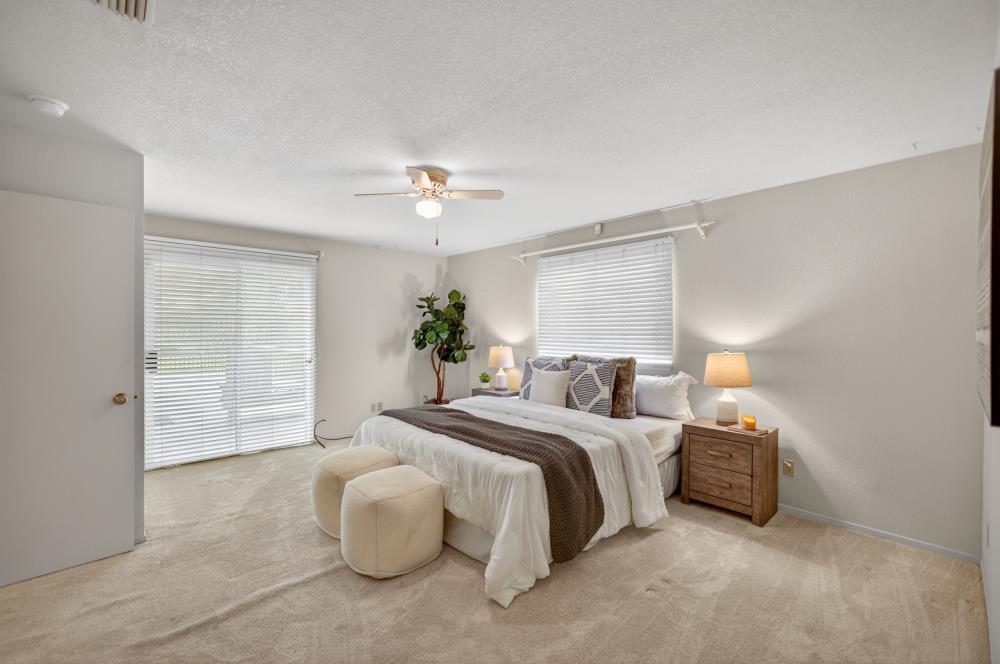 7649 El Modena Avenue Elverta, CA 95626 - Photo 39 of 75 a bedroom with a bed and a chandelier