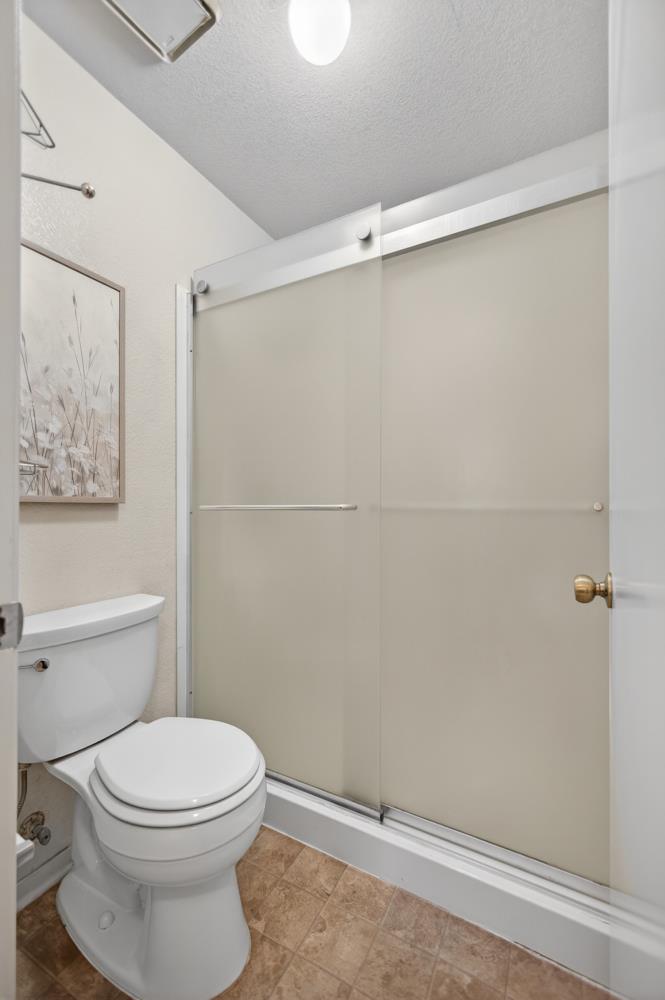 7649 El Modena Avenue Elverta, CA 95626 - Photo 45 of 75 a bathroom with a toilet and a shower