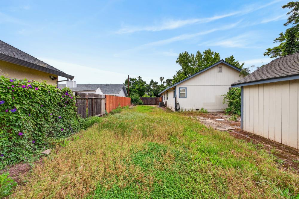 7649 El Modena Avenue Elverta, CA 95626 - Photo 60 of 75 a backyard of a house with plants and large tree