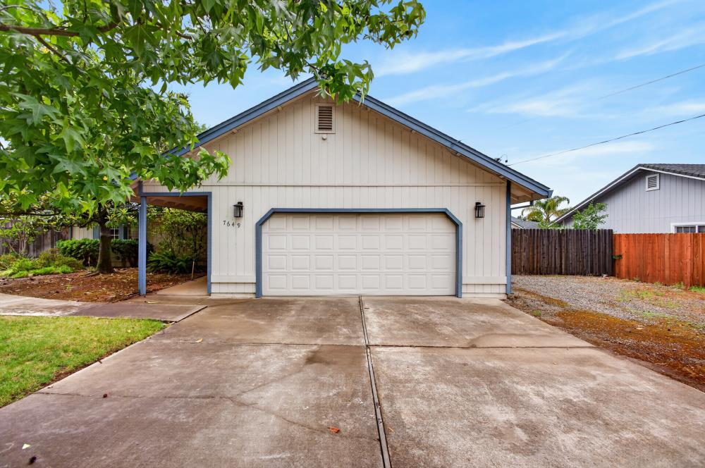 7649 El Modena Avenue Elverta, CA 95626 - Photo 6 of 75 a front view of a house with a yard and garage