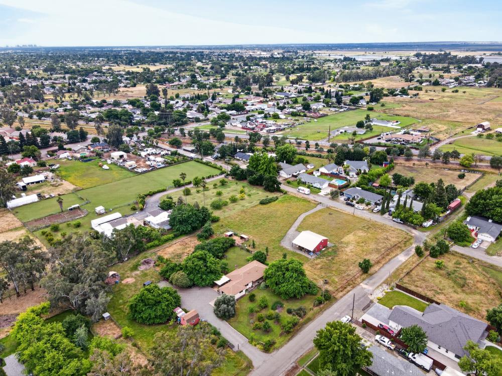 7649 El Modena Avenue Elverta, CA 95626 - Photo 73 of 75 an aerial view of a city with lots of residential buildings