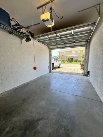 a view of an empty room with a garage