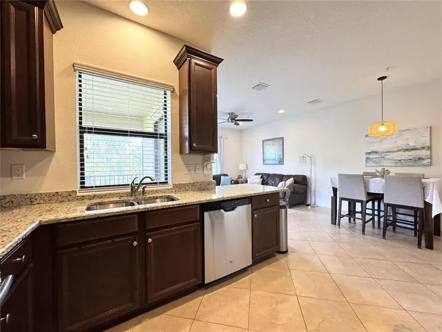 a kitchen with lots of counter top space and dining table