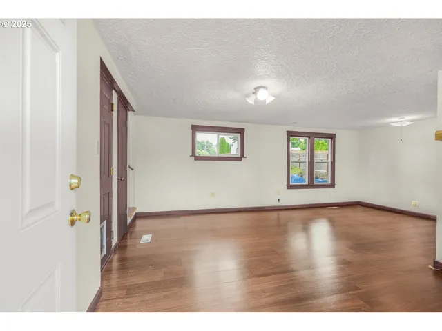 a view of an empty room and window